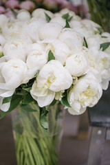 Lovely flowers in glass vase. Beautiful bouquet of white peonies . Floral composition, scene, daylight. Wallpaper