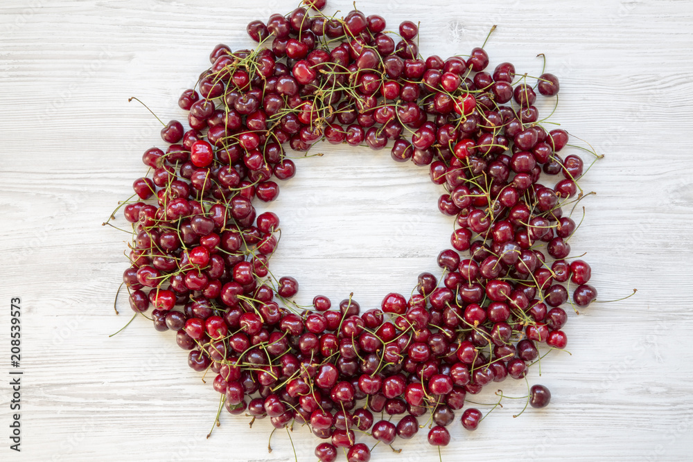 Wall mural circle made of ripe cherry, top view. copy space.