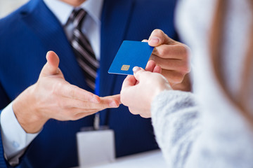 Woman makes payment with credit card 