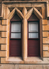 Maltese old blue window with curtains, Malta