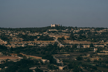 View to Tal-Virtu Palazzo and agriculture fields in countryside of Malta