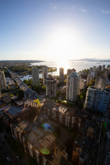 Striking Aerial View of the Modern City during a vibrant sunset. Taken in Downtown Vancouver, British Columbia, Canada.