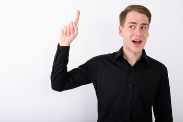 Fototapeta premium Young handsome businessman against white background