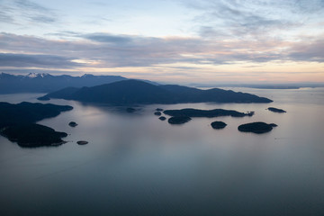 Fototapeta premium Aerial view of the Islands in Howe Sound during a vibrant sunset. Taken Northwest of Vancouver, British Columbia, Canada.