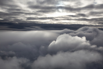 Aerial cloudscape view of the puffy clouds. Taken North of Vancouver, British Columbia, Canada.
