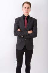 Obraz na płótnie Canvas Young handsome businessman wearing suit against white background