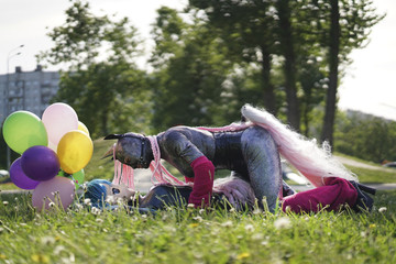 funny freaks, dressed in a unicorn bright costume and anime face mask with latex catsuit, enjoy...