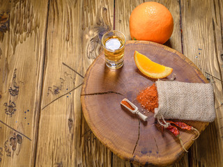 Mezcal shot mexican drink with orange slices, chili pepper and worm salt in oaxaca mexico. Top view with copy space .