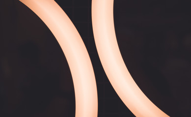 two glowing halves of a ring on a dark background
