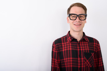 Young handsome man wearing eyeglasses against white background