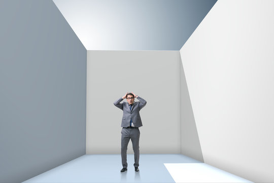 Businessman trying to escape from difficult situation