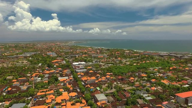 Aerial view of Seminyak and Kuta areas near ocean in Bali, Indonesia on sunny summer day