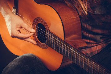 Male hands with guitar