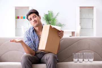 Man receiving wrong parcel with glasses