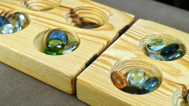kids playing mancala, playing mancala,

