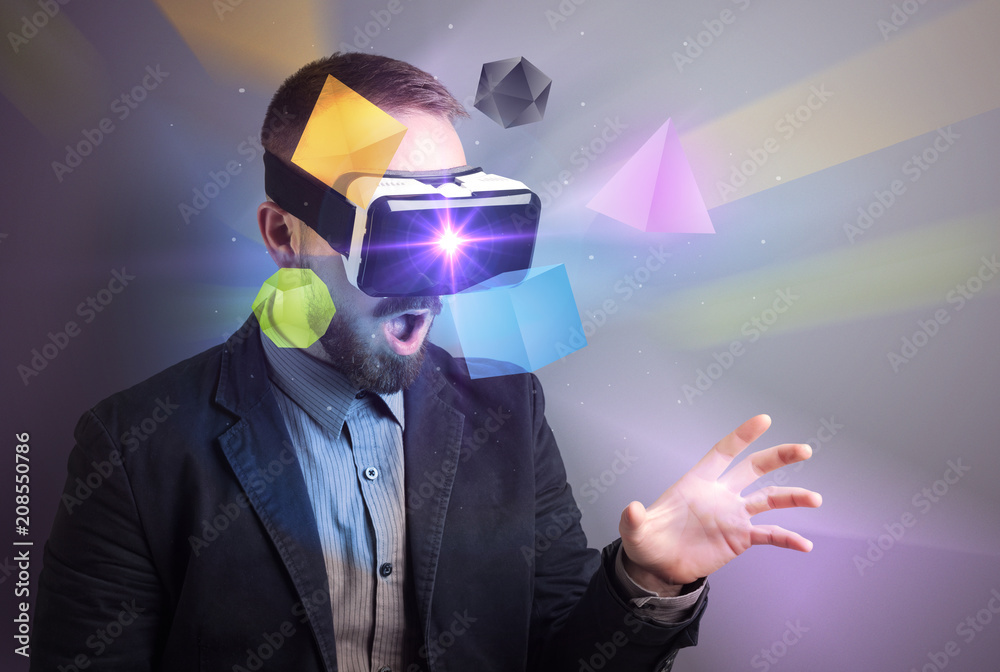 Poster amazed businessman with virtual reality colorful geometric shapes in front of him