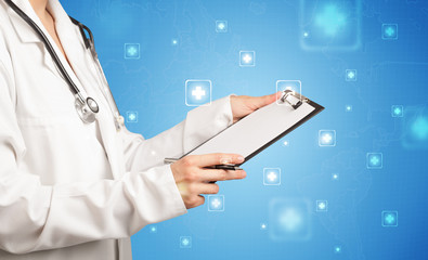 Female doctor holding notepad with blue background and crosses