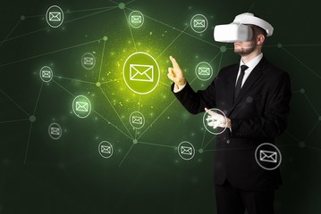 Young businessman in virtual reality glasses organize online network communication