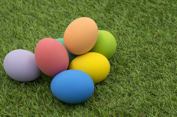 colorful easter eggs on green grass background