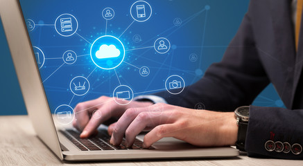 Businessman hand typing with cloud technology system and office symbol concept
