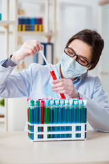 Female chemist working in hospital lab