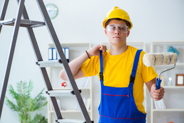 Painter working at home in refurbishment project