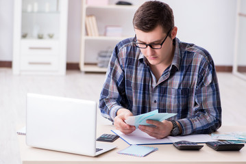 Young man frustrated at his house and tax bills