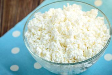 Cottage cheese on blue background.