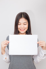 Naklejka premium Beautiful young asian women holding blank white paper banner