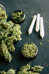 trichomes and crushed weed on a black table insta buds marijuana Macro of cannabis with