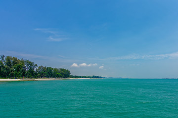 Singapore East Coast facing east with turquoise water and beach in the background