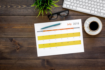 Planning at work. Strategy planning. Business development concept. Set the goals. Calendar on dark...