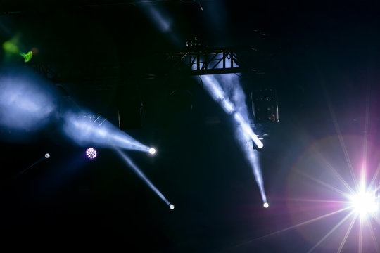 concert stage view, lights of projector equipment over dark stage