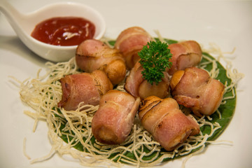Deep Fried Bacon Wrapped Sausage with sauce