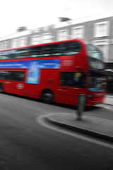 Iconic London red double decker bus, abstract with motion blur and selective color