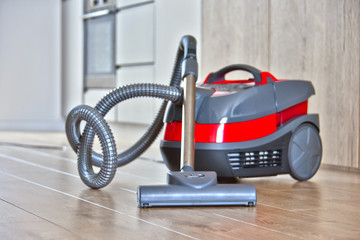 Canister vacuum cleaner for home use on the floor