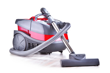 Canister vacuum cleaner for home use isolated on white
