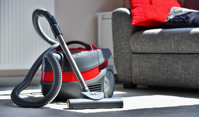 Canister vacuum cleaner for home use on the floor