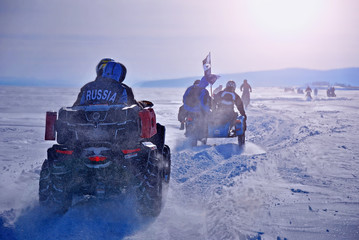 Extreme sport. Winter race on motorcycles and ATVs. Motorcycles and quads on the winter road.