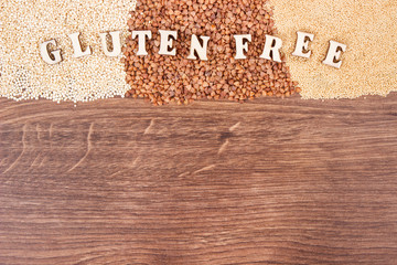 Gluten free inscription with amaranth, quinoa and buckwheat, healthy food concept, copy space for text