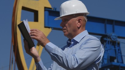 Petroleum Engineer Working in Extracting Oil Industry Using Agenda 