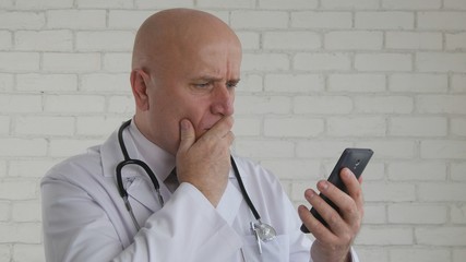 Upset Doctor Make Disappointed Hand Gestures Reading Bad News on Cell Phone