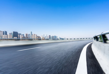 panoramic city skyline with empty asphalt road
