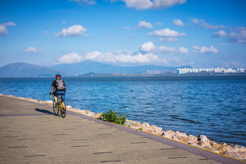sport man cycling on the road