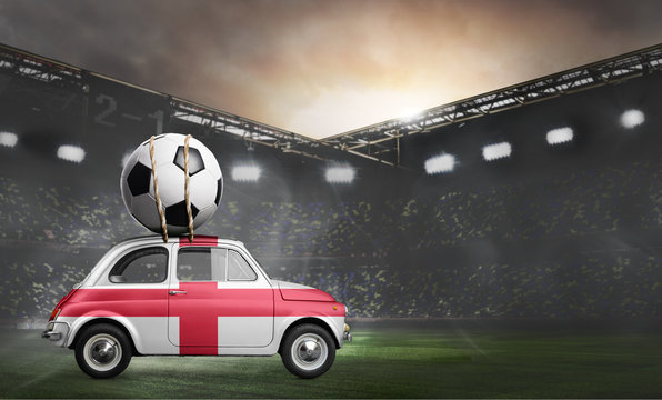 England flag on car delivering soccer or football ball at stadium