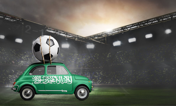 Saudi Arabia flag on car delivering soccer or football ball at stadium