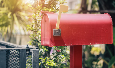 red american style letterbox with the raised rod to signal the presence of mail.selective focus.