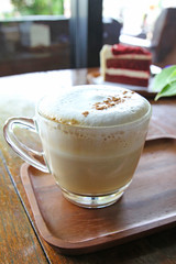 Cup of coffee and Red velvet cake on wooden table