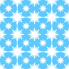 Abstract seamless pattern of white snowflakes on a blue background