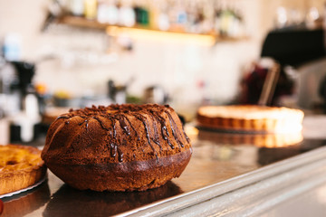 A fresh cupcake on the counter of a bar or in a cafe or in a small home-made food shop